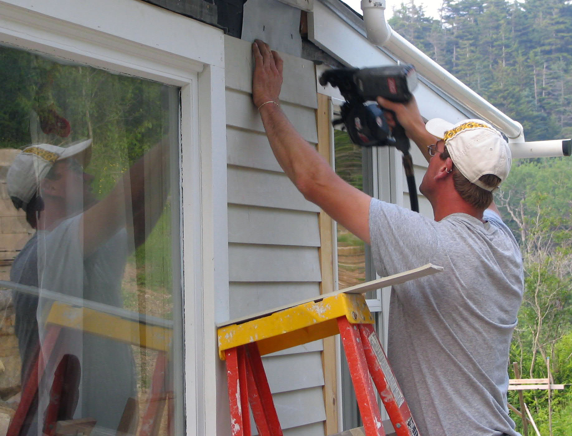 Kole nailing clapboards