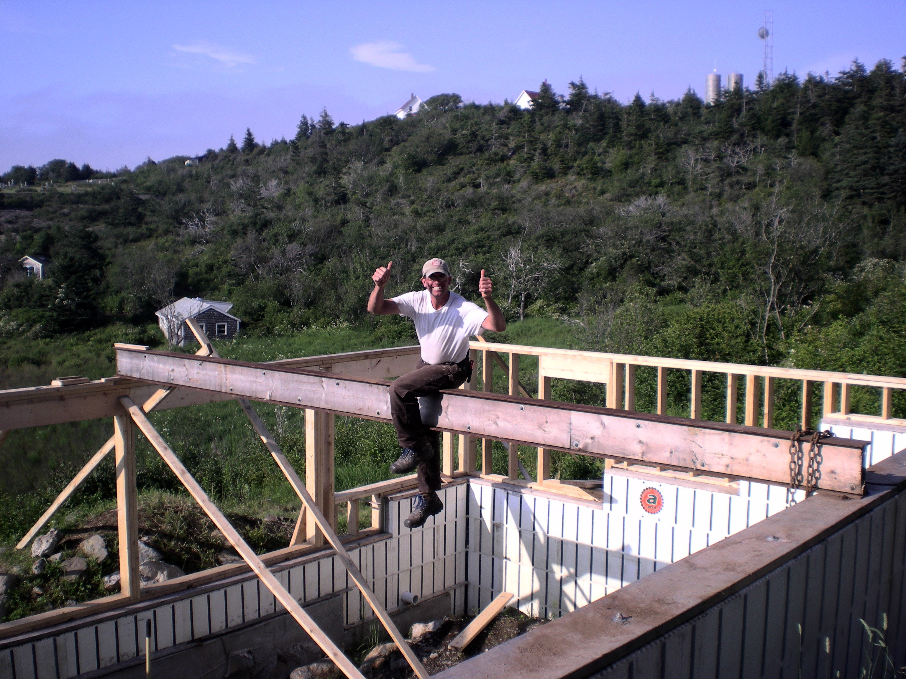 Kole sitting on supporting beam of new construction