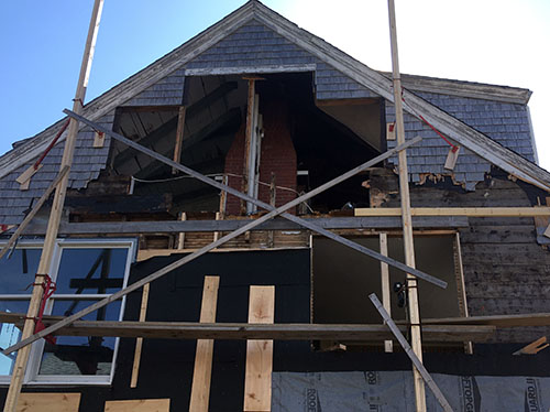 Windows and shingles removed from building