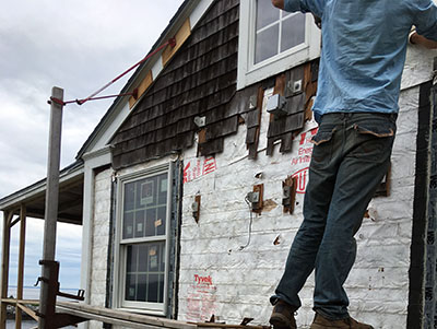 Side of house with shingles removed
